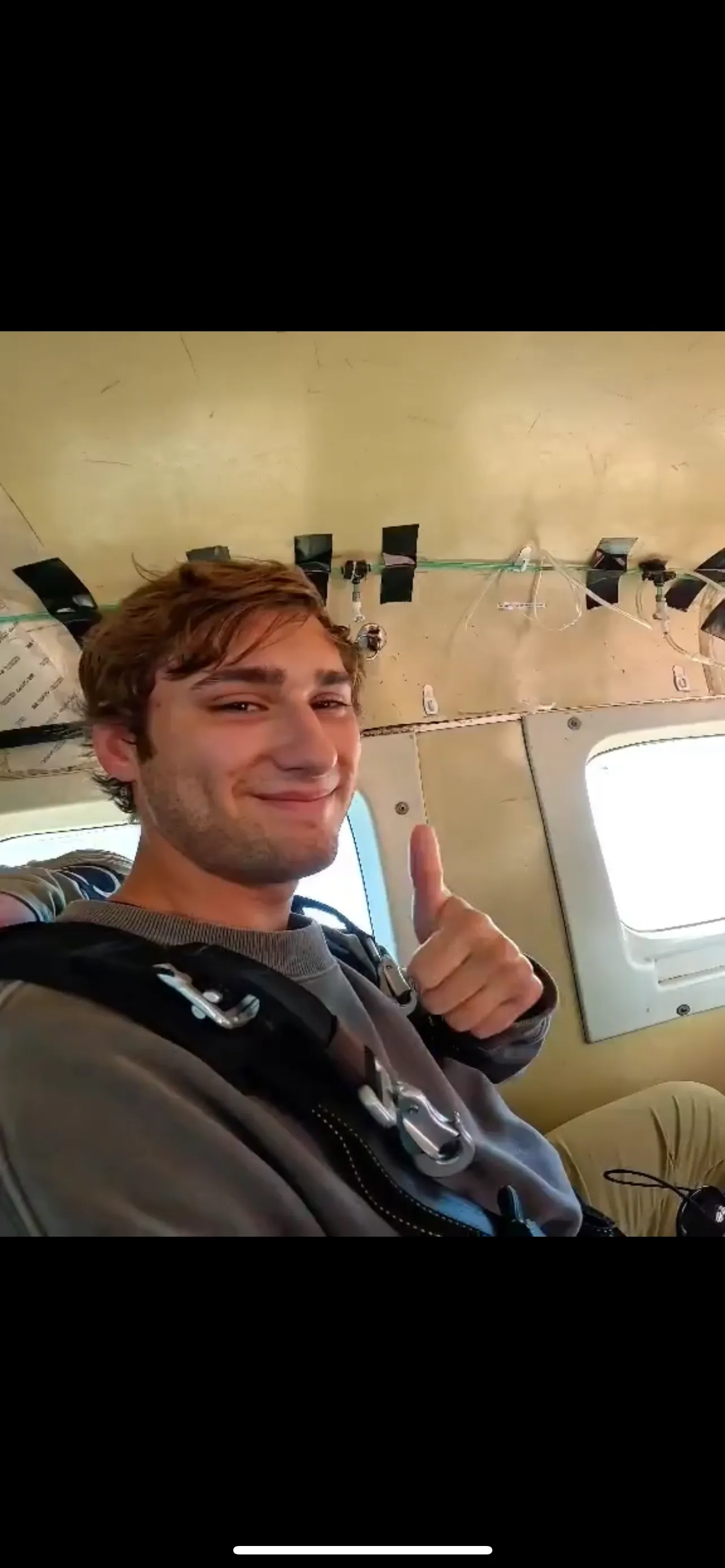 Me giving a thumbs up in the plane before the jump